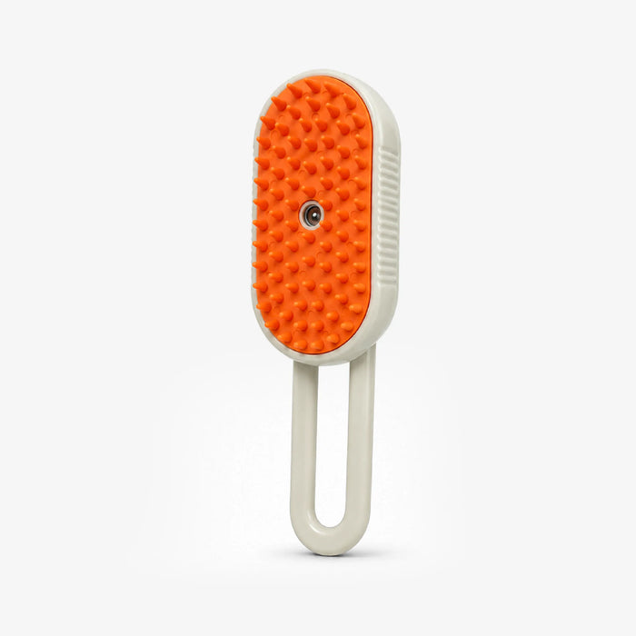 Pet brush with orange silicone bristle pad and white oval handle