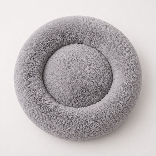 Gray donut-shaped pet bed with circular center nest