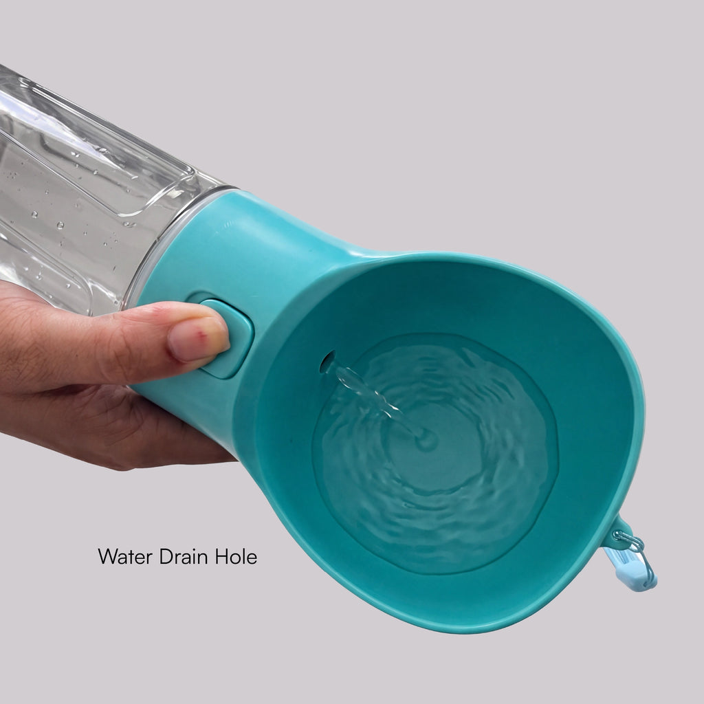 Teal pet waste cleanup water dispenser with drain hole close-up