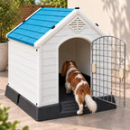 Outdoor pet house with blue roof and open door, dog inside