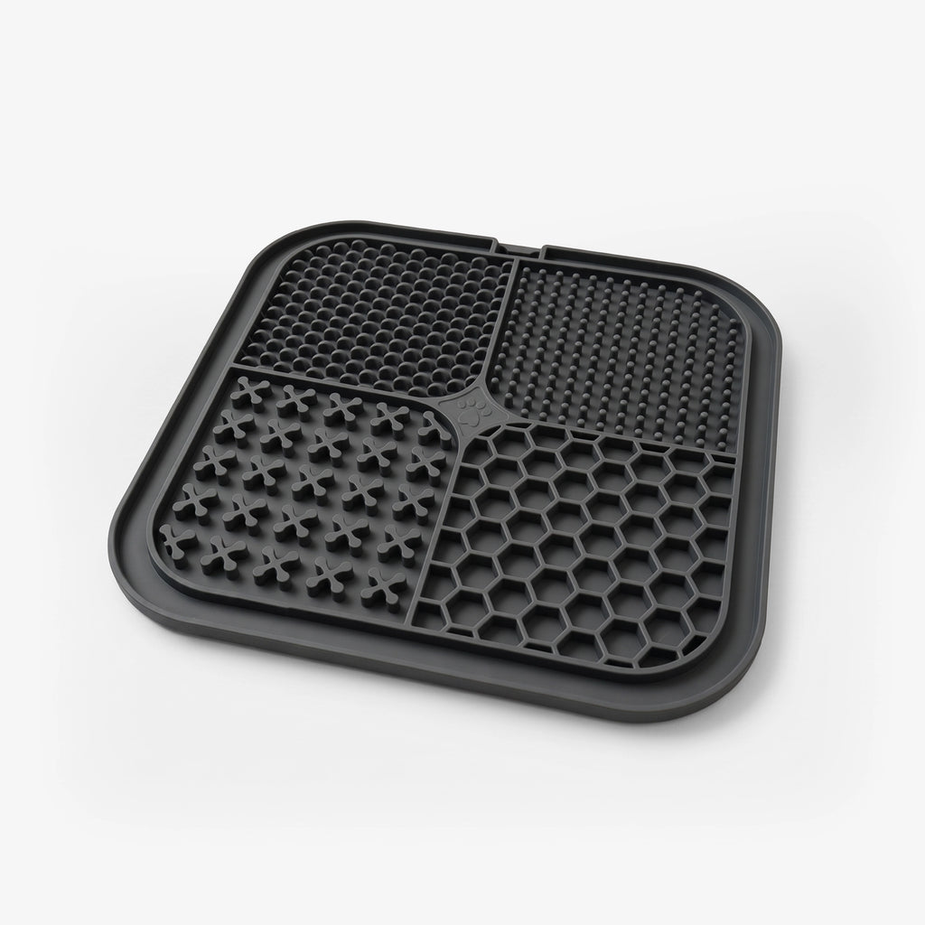 Black silicone dog food mat with raised nibs and hex compartments