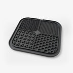Black silicone dog food mat with raised nibs and hex compartments