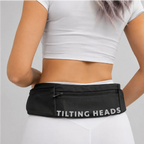 Black hands-free dog belt with front zip pocket and “TILTING HEADS” logo